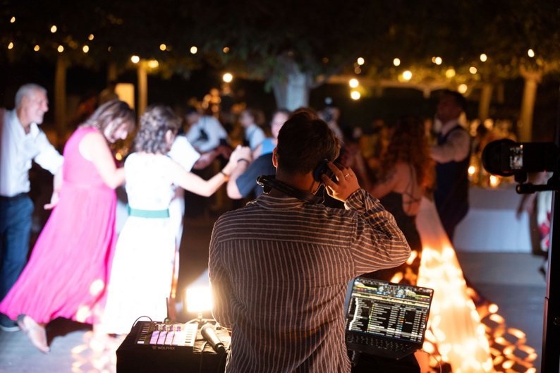 Guests dancing next to the DJ booth